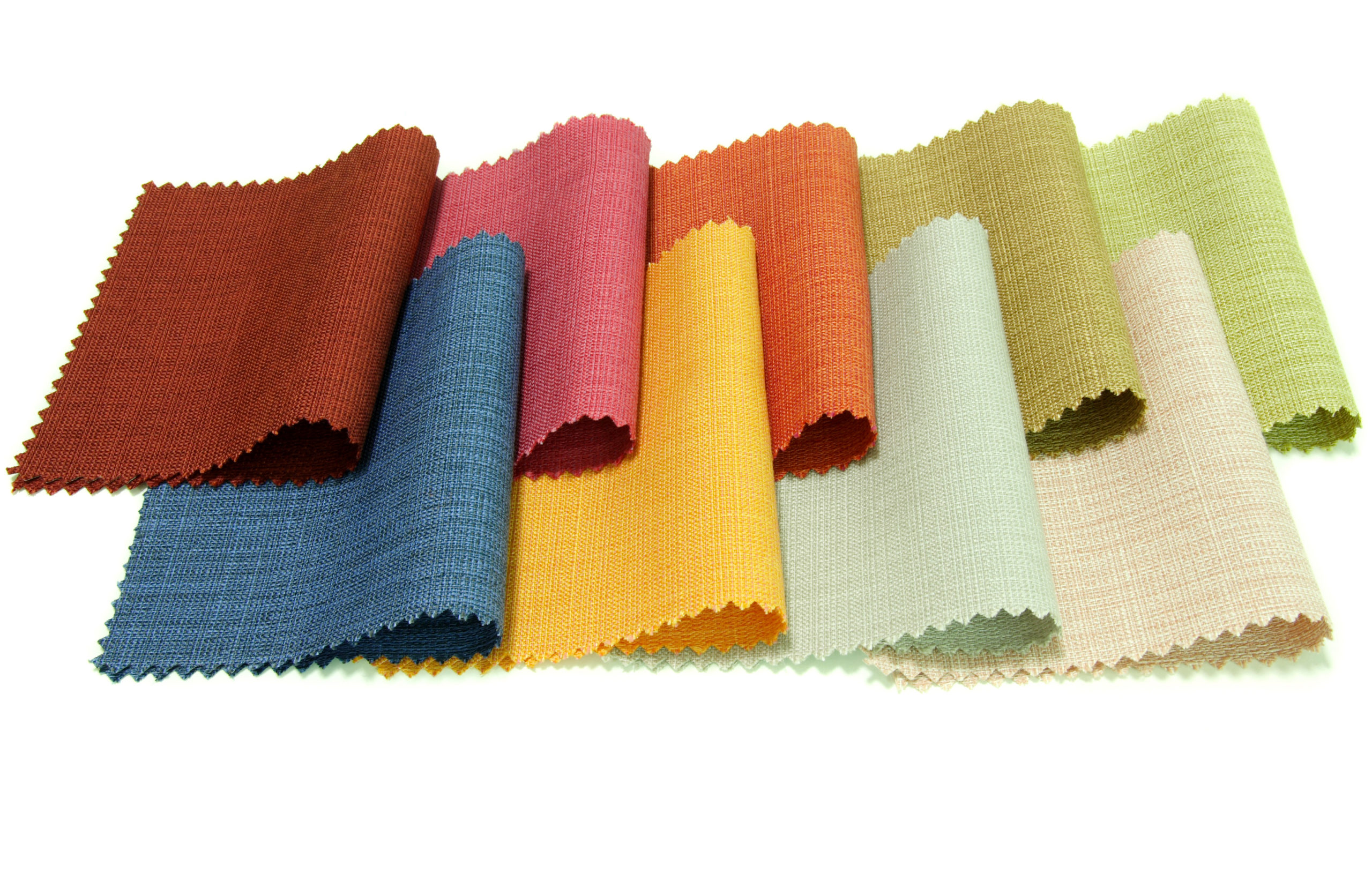 Colorful fabric swatches in various weights and textures arranged in an overlapping pattern